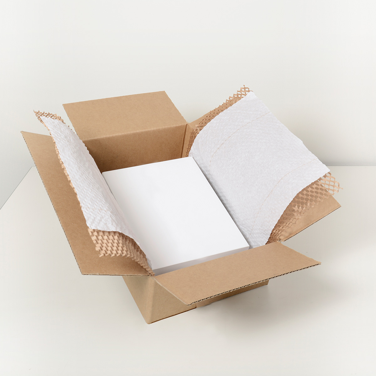Uzupełnienie pudełka papierem przy pomocy Geami WrapPak M